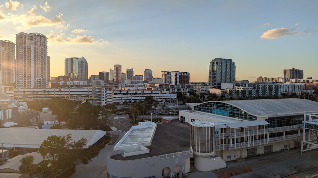 A stunning view of Tampa skyline at sunset, highlighting modern architecture and urban landscape.